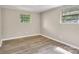 Bedroom with hardwood floors and natural light from the two windows at 5221 Wales St, Charlotte, NC 28269