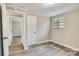 A view of the bedroom showing the closet and hardwood floors at 5221 Wales St, Charlotte, NC 28269