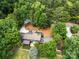 Stunning aerial view of a private home surrounded by lush, mature trees and manicured landscaping at 54 Honeysuckle Woods, Clover, SC 29710