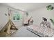 Adorable bedroom featuring playful animal themed wall decorations, carpet and a fun teepee at 54 Honeysuckle Woods, Clover, SC 29710