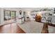 Cozy living room with comfortable recliners, picture ledge, and access to screened porch at 54 Honeysuckle Woods, Clover, SC 29710