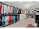 Spacious walk-in closet with custom shelving, cabinetry and chandelier lighting at 54 Honeysuckle Woods, Clover, SC 29710