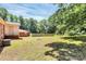 Expansive backyard featuring lush greenery and a tranquil setting with a wooden fence at 6517 Paleface Pl, Charlotte, NC 28214