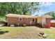 The backyard provides a serene retreat with lush greenery and ample space for recreation at 6517 Paleface Pl, Charlotte, NC 28214