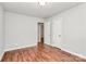 Empty bedroom featuring wood floors, neutral walls, and two closets, ready for your personal touch at 6517 Paleface Pl, Charlotte, NC 28214