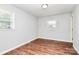 Bedroom featuring neutral walls, wood-look flooring, and natural light at 6517 Paleface Pl, Charlotte, NC 28214