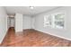 Bright living room featuring beautiful wood floors, a neutral color palette, and plenty of natural light at 6517 Paleface Pl, Charlotte, NC 28214