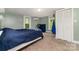 This cozy bedroom features natural light, a closet, and a modern AC unit for comfort at 702 S Government St, Lincolnton, NC 28092