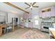 Eat-in kitchen features pastel-colored cabinets, stainless appliances, an eat-in table, and wood-look floors at 702 S Government St, Lincolnton, NC 28092