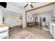 Spacious kitchen features stainless steel appliances, pastel-colored cabinets, and eat-in dining space at 702 S Government St, Lincolnton, NC 28092