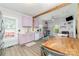 Updated kitchen boasts modern appliances, pastel-colored cabinets, eat-in space and wood-look flooring at 702 S Government St, Lincolnton, NC 28092