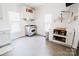 Well-lit kitchen with stainless steel range, butcher block countertop, and ample storage space at 702 S Government St, Lincolnton, NC 28092