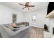 Bright living room features a ceiling fan and windows that bring in natural light and neutral paint at 702 S Government St, Lincolnton, NC 28092