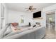 Cozy living room with fireplace, ceiling fan, and large sectional sofa, creating a comfortable atmosphere at 702 S Government St, Lincolnton, NC 28092