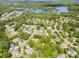A lovely neighborhood is shown from the air with tree-lined streets and a beautiful lake in the background at 812 Thornapple Ct, Lake Wylie, SC 29710