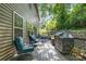Outdoor wooden deck with cozy chairs and a barbecue grill at 812 Thornapple Ct, Lake Wylie, SC 29710