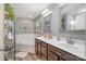 Bright, modern bathroom featuring double vanity, soaking tub, and natural light at 812 Thornapple Ct, Lake Wylie, SC 29710