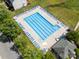 Aerial view of the community pool with lounge chairs and green surroundings at 812 Thornapple Ct, Lake Wylie, SC 29710