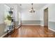 Spacious dining room with hardwood floors, decorative trim, and natural light creating an inviting atmosphere at 812 Thornapple Ct, Lake Wylie, SC 29710