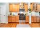 Kitchen with hardwood floors, stainless steel appliances, white subway tile backsplash, and generous cabinet space at 812 Thornapple Ct, Lake Wylie, SC 29710