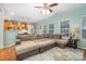Inviting living area blending seamlessly with the kitchen, featuring a large sectional and ample natural light at 812 Thornapple Ct, Lake Wylie, SC 29710