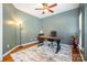 Home office space with a ceiling fan, desk, and a neutral-toned rug creating a comfortable workspace at 812 Thornapple Ct, Lake Wylie, SC 29710
