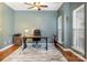 Dedicated office space with natural light, wood-look floors, ceiling fan, desk, and ample room for productivity at 812 Thornapple Ct, Lake Wylie, SC 29710