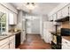 Bright kitchen featuring white cabinets, wood countertops, and modern appliances at 9021 Louvaine Dr, Charlotte, NC 28227