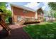 Spacious backyard features a large deck and lush green lawn, perfect for outdoor living at 905 Patricians Ln, Monroe, NC 28110