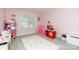 Bedroom featuring play market, pink tent, cloud rug, and pink walls at 905 Patricians Ln, Monroe, NC 28110
