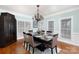 Dining room showcasing a large table with seating for six, a cabinet, and natural light at 905 Patricians Ln, Monroe, NC 28110