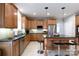 Well-equipped kitchen boasting stainless steel appliances, ample cabinet space, and island with seating at 905 Patricians Ln, Monroe, NC 28110