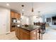 Open concept kitchen with stainless steel appliances, granite countertops and barstool seating at 905 Patricians Ln, Monroe, NC 28110