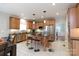 Functional kitchen with stainless appliances, an island with seating, and view to dining area at 905 Patricians Ln, Monroe, NC 28110