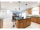 Inviting kitchen with stainless steel appliances, center island with seating and an open layout concept at 905 Patricians Ln, Monroe, NC 28110