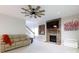 View of living room with fireplace, stairway, and comfortable seating, perfect for relaxation at 905 Patricians Ln, Monroe, NC 28110
