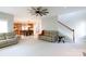 Bright and airy living room with open access to kitchen, dining area, and stairway at 905 Patricians Ln, Monroe, NC 28110