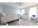 Light and airy bedroom with soft blue walls, bright accents, and comfortable furnishings at 905 Patricians Ln, Monroe, NC 28110