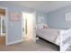 Charming bedroom featuring neutral paint and a doorway to the main bedroom at 905 Patricians Ln, Monroe, NC 28110