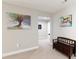 Hallway with neutral carpet and decorative artwork at 905 Patricians Ln, Monroe, NC 28110