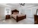 Elegant bedroom with ornate wood furniture and floral bedding at 905 Patricians Ln, Monroe, NC 28110