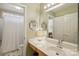 Well-lit bathroom with a large mirror, vanity, and a shower/tub combination, perfect for daily routines at 909 Staghorn Ln, Waxhaw, NC 28173