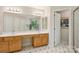 Bright bathroom features double sinks, ample cabinet space, and a full length mirror at 909 Staghorn Ln, Waxhaw, NC 28173