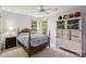 Comfortable bedroom with neutral walls, ceiling fan, and bright windows, providing a relaxing retreat at 909 Staghorn Ln, Waxhaw, NC 28173