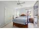Inviting bedroom featuring a ceiling fan, neutral walls, and natural light from a large window at 909 Staghorn Ln, Waxhaw, NC 28173