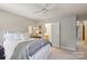Bright bedroom with a comfortable bed, side table, and an open doorway, providing a cozy and inviting space at 909 Staghorn Ln, Waxhaw, NC 28173
