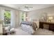 Charming bedroom featuring natural light, a cozy chair, and a decorative mirror, creating a serene atmosphere at 909 Staghorn Ln, Waxhaw, NC 28173