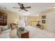 Bright bonus room featuring a ceiling fan and comfortable seating area, perfect for relaxation and entertaining at 909 Staghorn Ln, Waxhaw, NC 28173