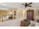 Upstairs bonus room features neutral carpet, a ceiling fan, and plenty of room for entertaining at 909 Staghorn Ln, Waxhaw, NC 28173