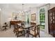 Formal dining room boasts ample natural light, classic chandelier, and elegant decor at 909 Staghorn Ln, Waxhaw, NC 28173